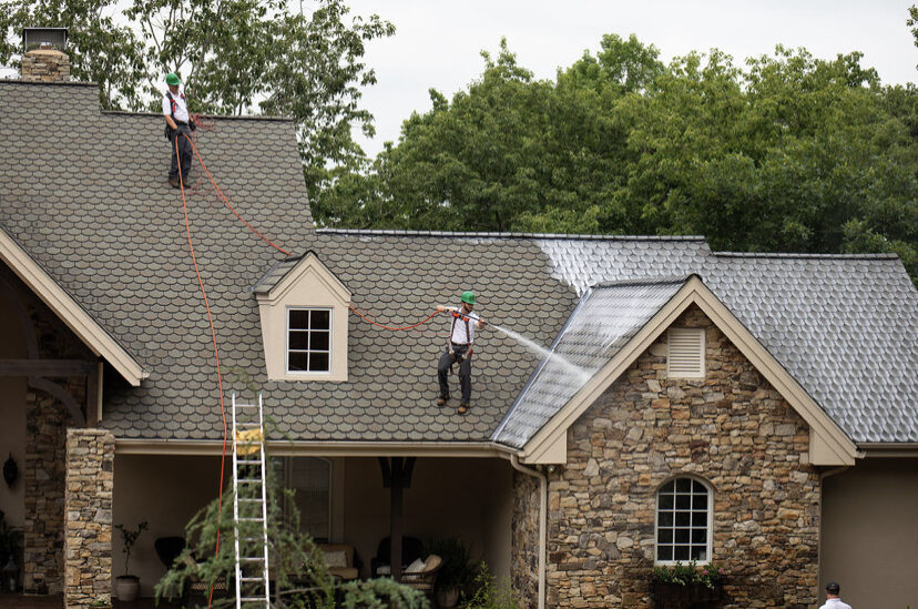Crew at work on a stone home